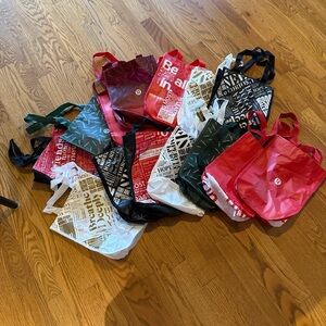 16 lululemon bags with different designs and colors